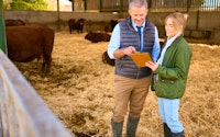 Farmer Talking In Shed