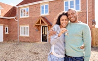 Couple young moving house conveyancing happy 1470584330