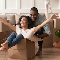 Couple young moving house conveyancing happy playing 1414418570