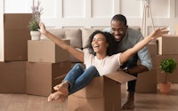 Couple young moving house conveyancing happy playing 1414418570