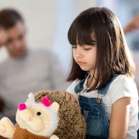 Divorce seperation young girl sad with teddy bear 1583226754