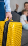 Divorce speration close up yellow suitcase 1360104137