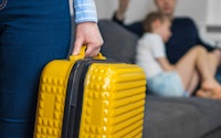 Divorce speration close up yellow suitcase 1360104137