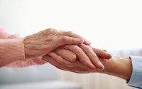 Elderly hands holding 1490797235