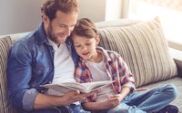 Family dad son reading happy 523948348