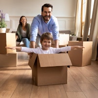 Family young moving house conveyancing happy playing 1686987238
