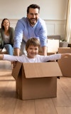 Family young moving house conveyancing happy playing 1686987238