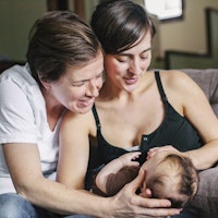 Family young same sex female couple with baby happy 604754282
