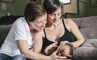 Family young same sex female couple with baby happy 604754282
