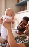 Family young same sex male couple with baby happy 1515641399