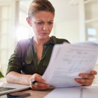Women unhappy concerned dispute paperwork contract 529543765